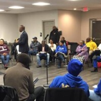 A group of parents in a community center.